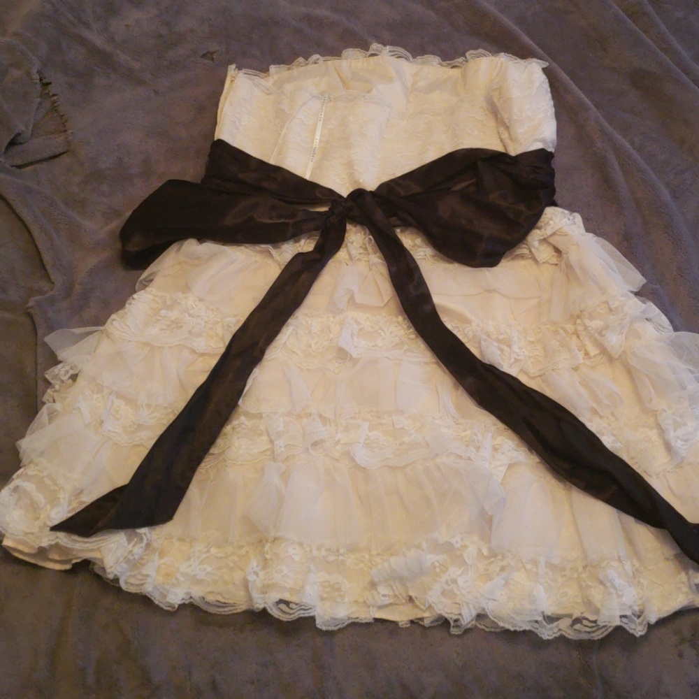 White ruffle dress with black ribbon